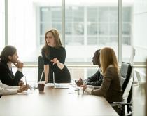 Woman leading executive meeting