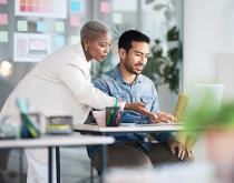 Colleagues working on laptop