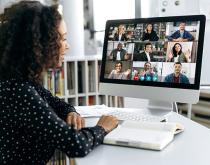 Woman attending virtual meeting on laptop