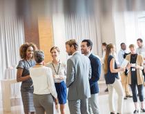 Business people talking at networking event