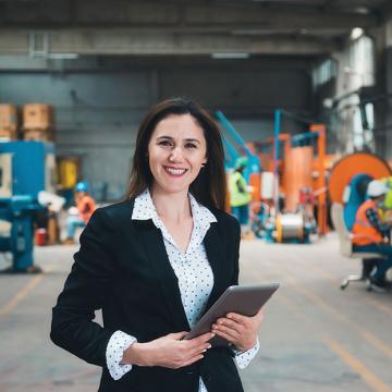 Female executive on factory floor