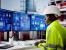 Manufacturing worker watching production screen