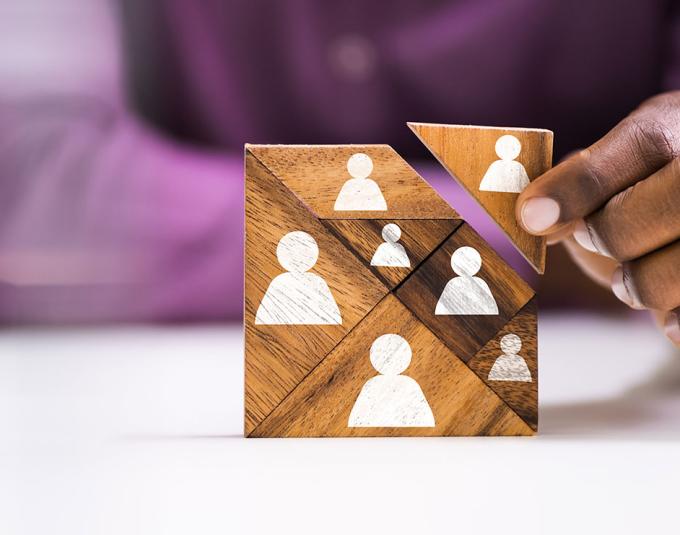 Business person adding game piece