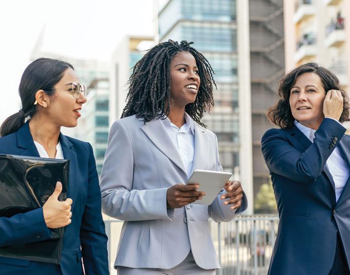 Diverse female leaders walking together